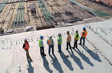 construction crew standing at construction site